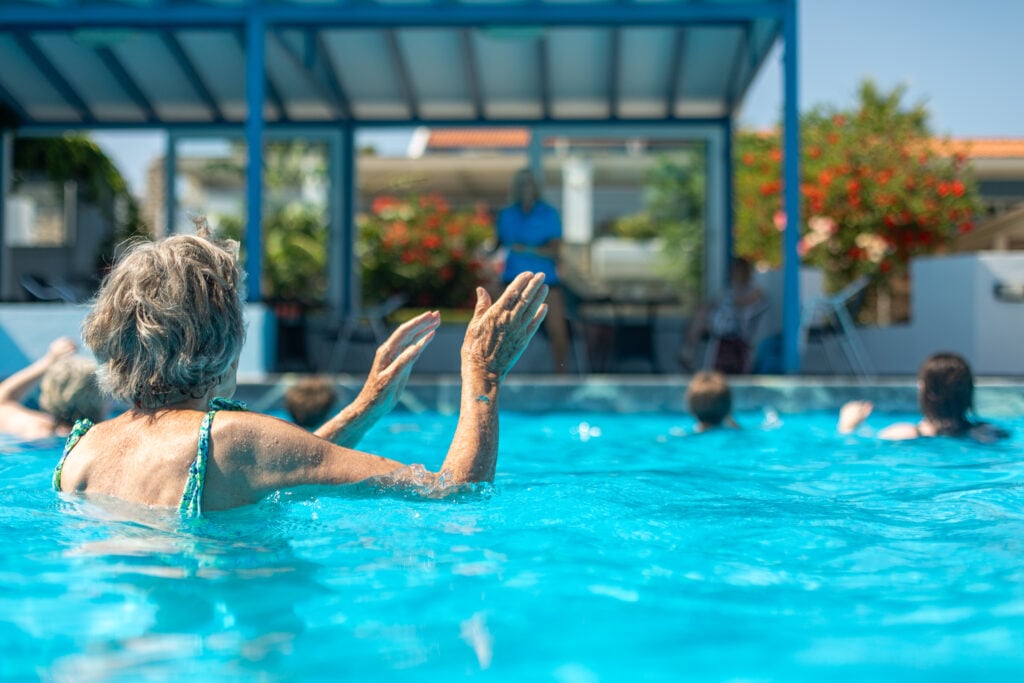 Richmond Holidays solo travelling guest joining in with the fun in the swimming pool!