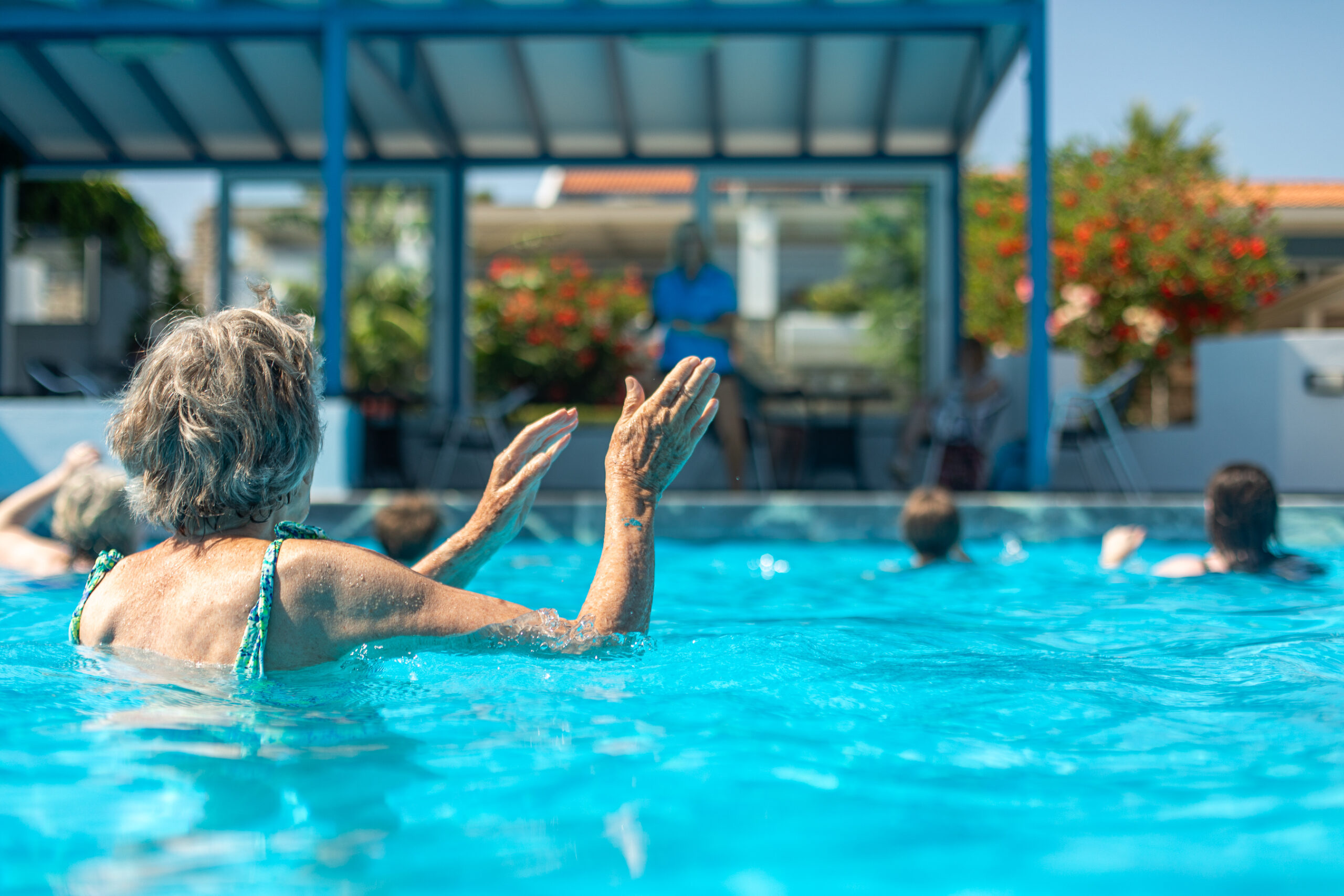 Richmond Holidays solo travelling guest joining in with the fun in the swimming pool!