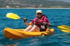 A lady kayaking in Samos, Greece