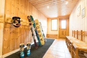 Skis lined up in the boot room of the holiday chalet