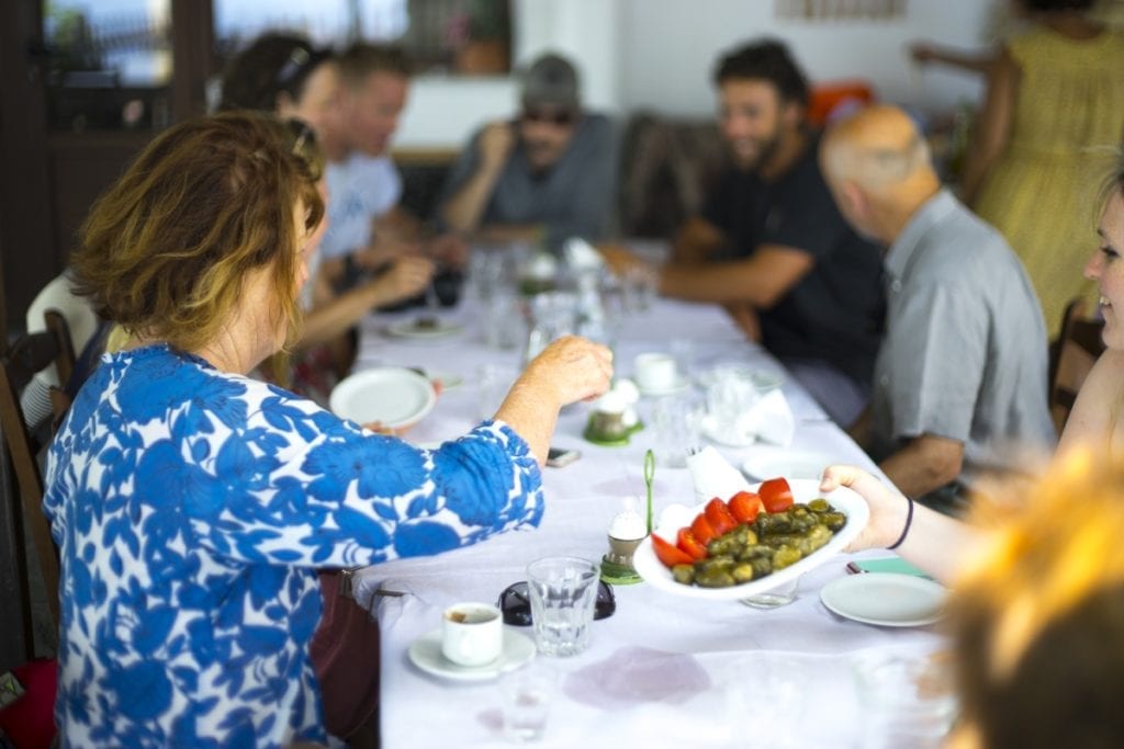 Guests having lunch together on their summer holiday in Samos, Greece
