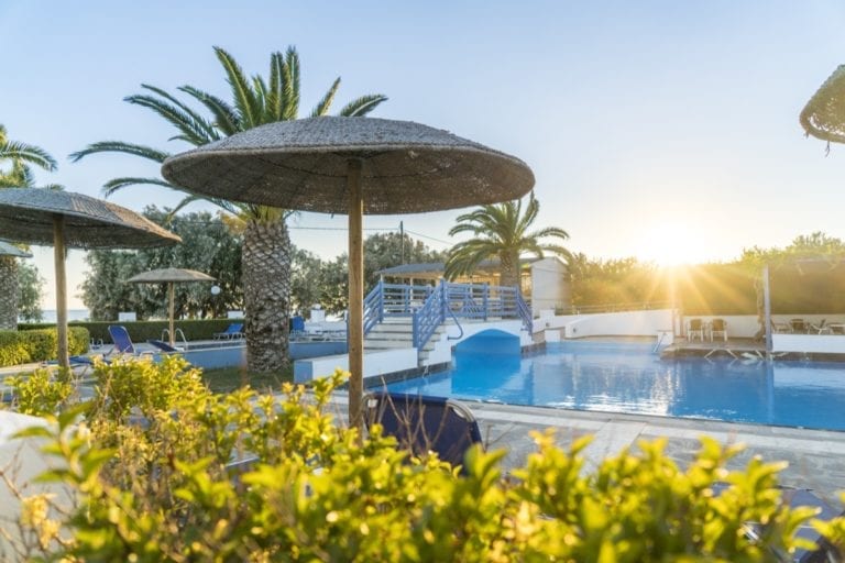 The sun rising over the swimming pool at the Zefiros Beach Hotel in Samos