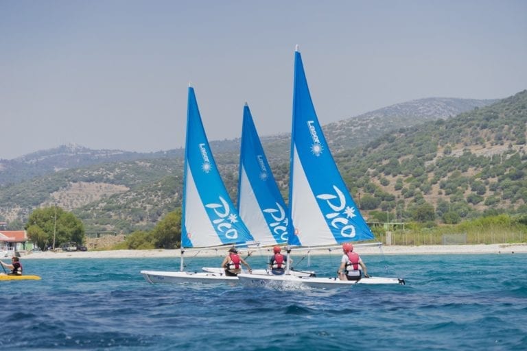 Three sailing boats on the water in Samos, Greece