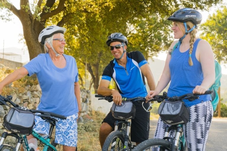 Biking with friends while on holiday in Samos, Greece in Summer