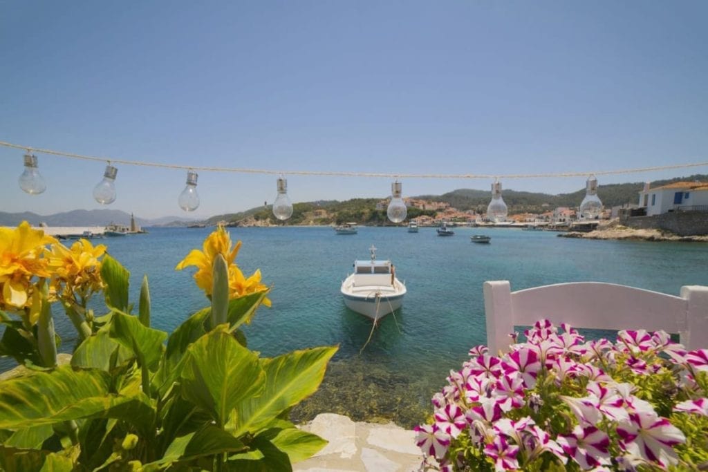 A boat and some flowers in Kokkari, Samos, Greece in summer