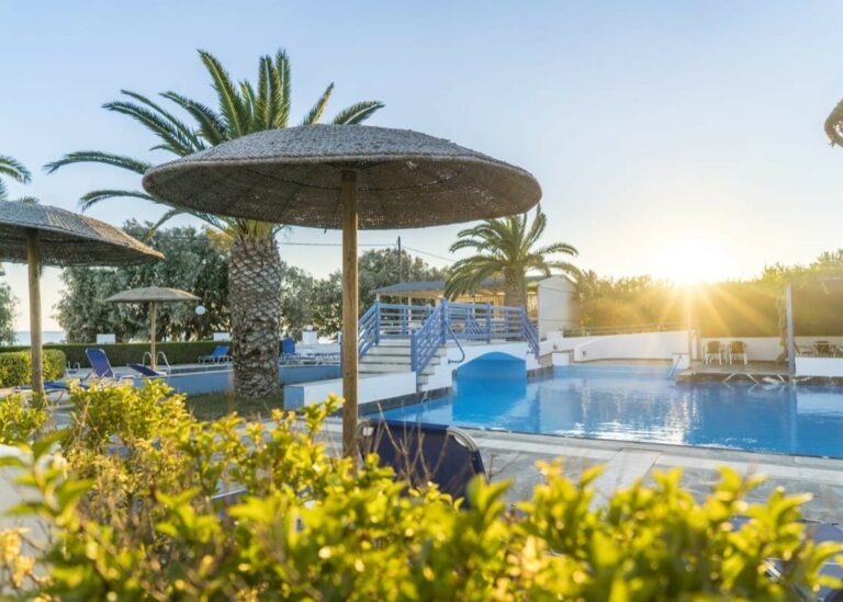 The sun rising over the swimming pool at the Zefiros Beach Hotel in Samos
