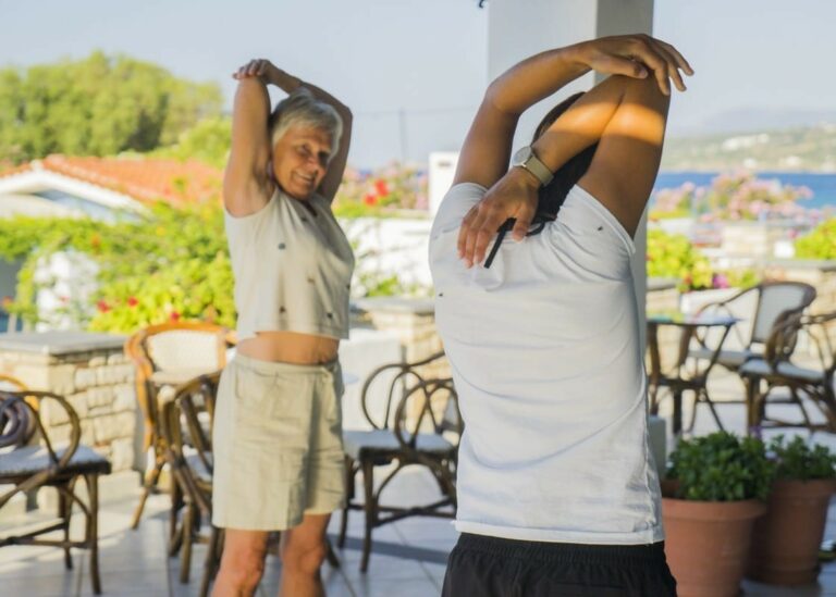 Morning stretches on the terrace on your summer holiday in Samos, Greece
