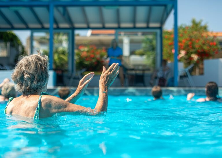 Guest enjoying the water aerobics, one of the activities available at the hotel