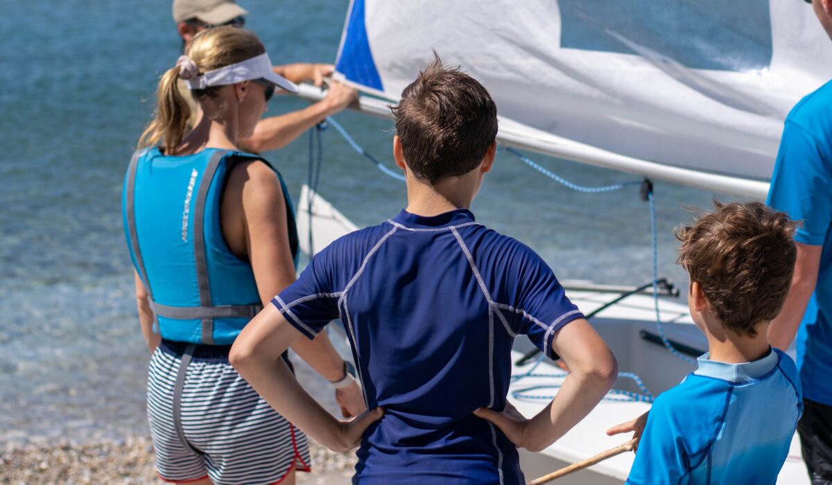 A young family waiting for their sailing lesson