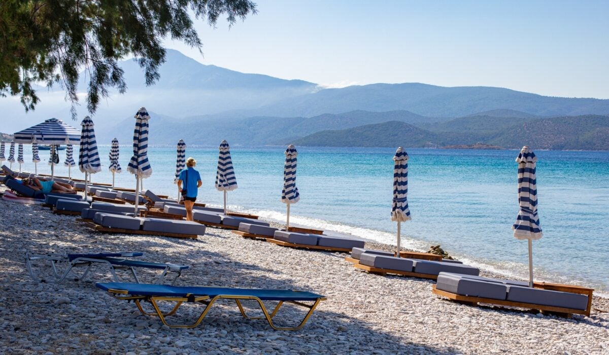 Side view of the beach outside the hotel and the row of sun loungers available