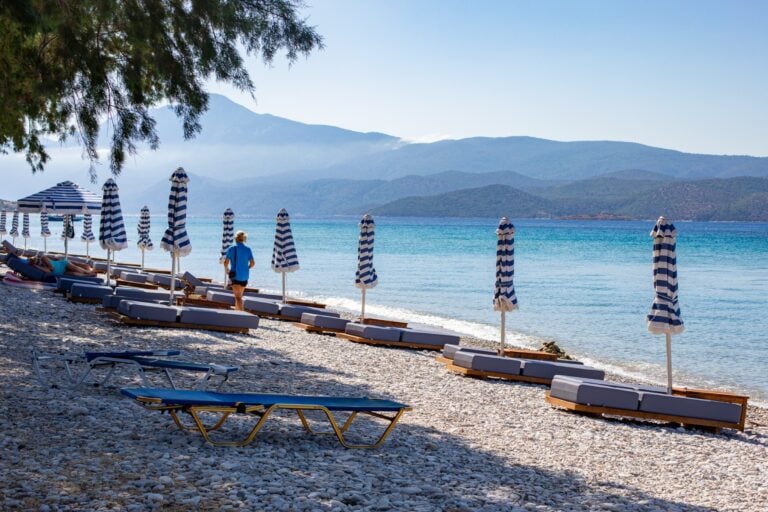 Side view of the beach outside the hotel and the row of sun loungers available