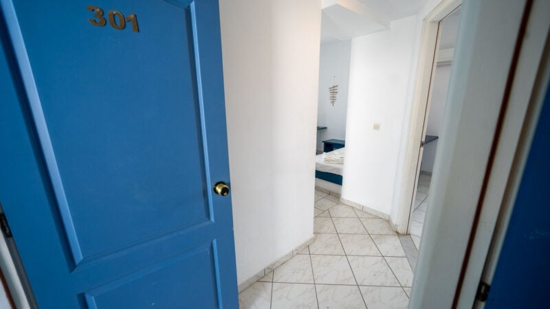 Entrance to the Corner Suite Room with two separate rooms and one bathroom.