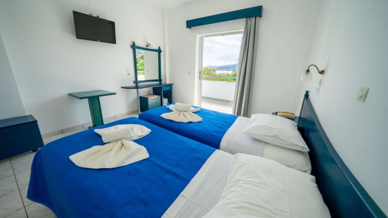 A Reception Level Room with two twin beds and a balcony with sea views.