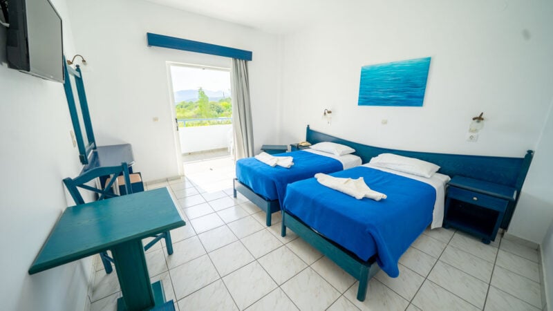 A Reception Level Room with two twin beds and a balcony with sea views.