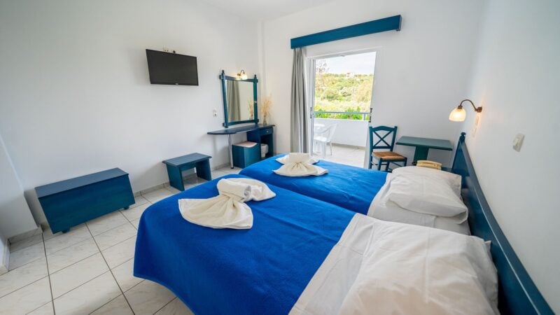 A Reception Level Room with two twin beds and a balcony with mountain views.