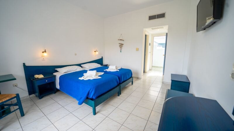 A Reception Level Room with two twin beds and a balcony with mountain views.