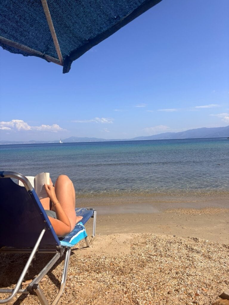 Reading a book on a sun lounger in Samos