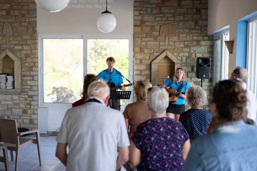 Two Richmond Worship Leaders singing in Ministry at Zefiros Beach Hotel