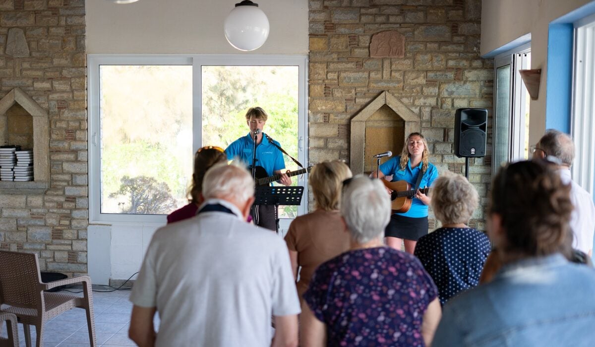 Two Richmond Worship Leaders singing in Ministry at Zefiros Beach Hotel