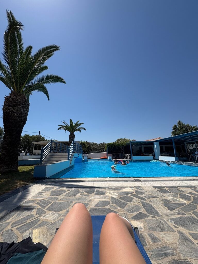 Sitting by the pool at the Zefiros Beach Hotel